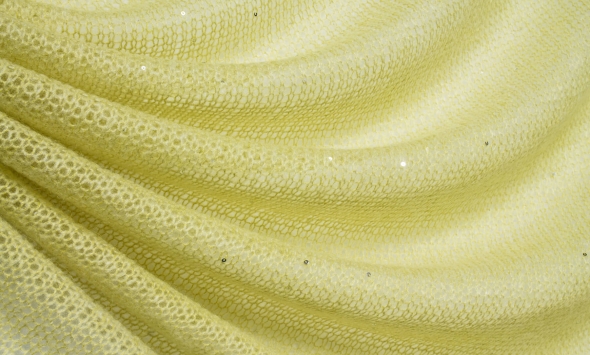 Тканина тонкий вовняний трикотаж для пошиття жіночого одягу італійський блідо-жовтого кольору з дрібними паєтками                                                                                                                                          - Фото
